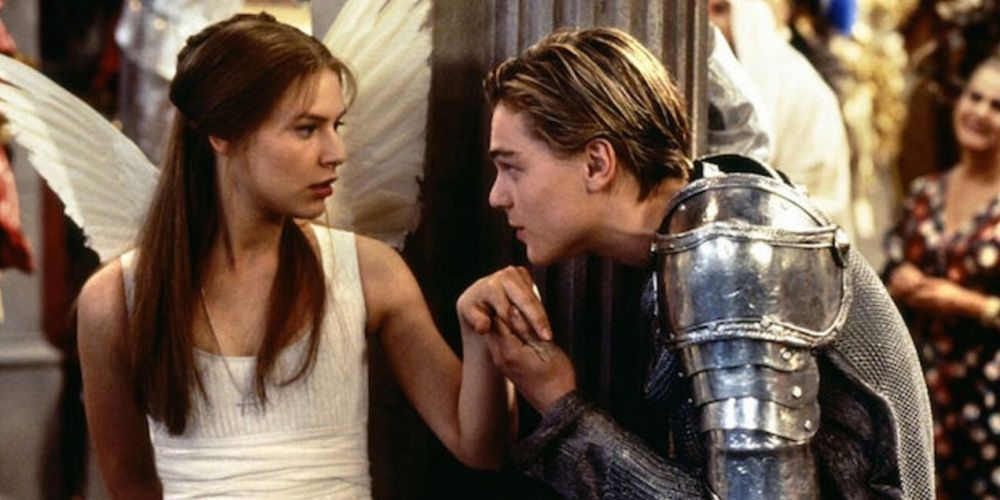 Romeo kisses Juliet's hand in Romeo + Juliet