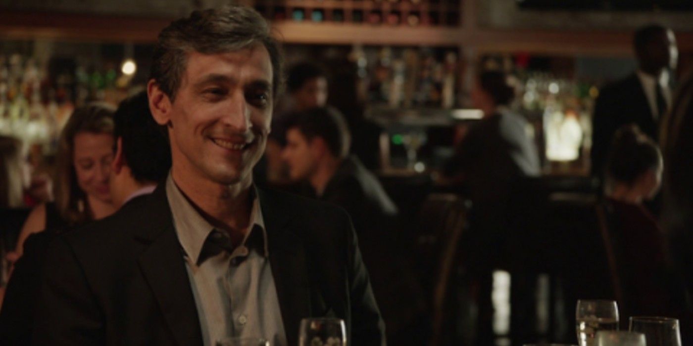 Andrew at a bar smiling in Veep