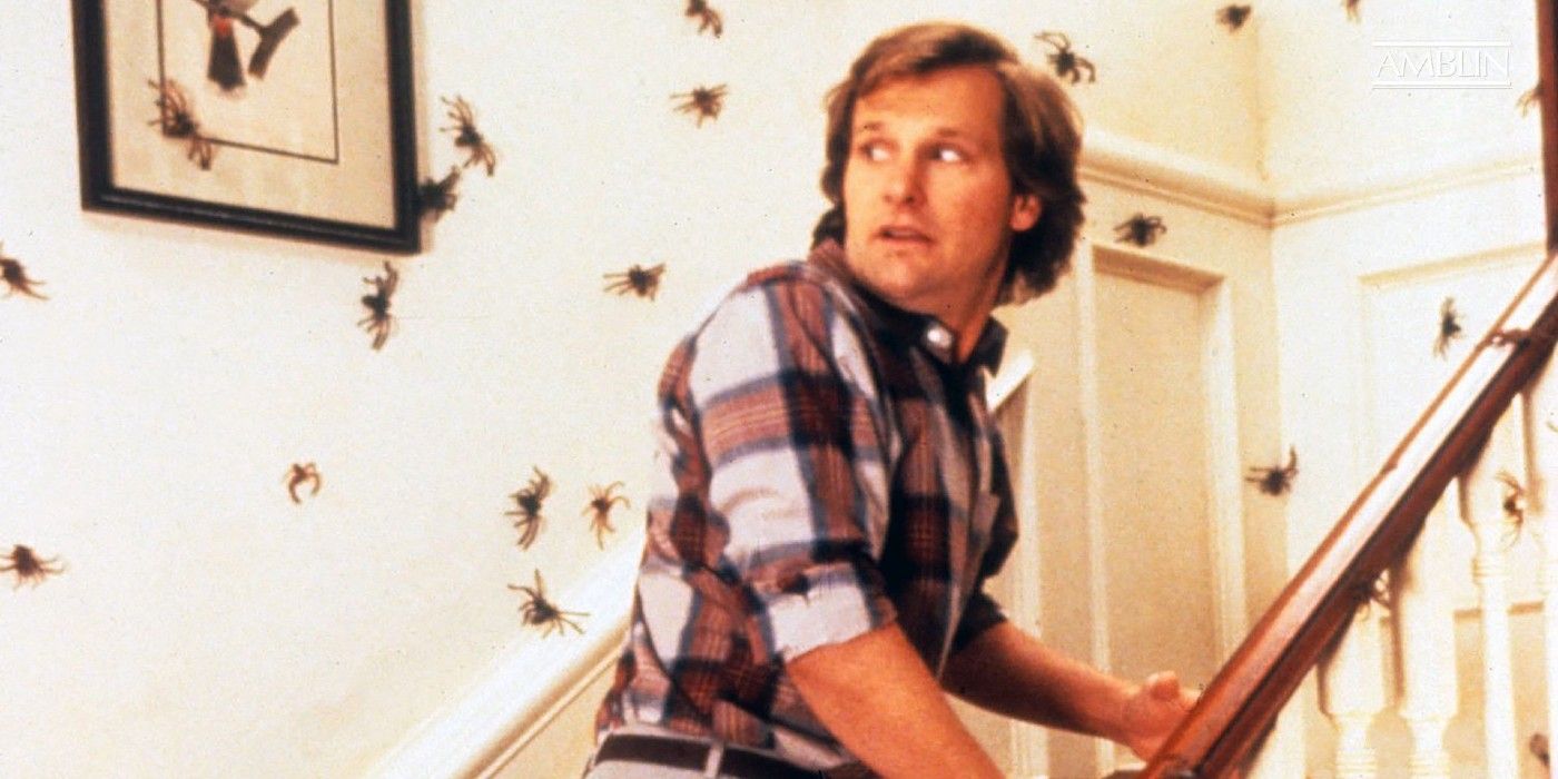 Jeff Daniels surrounded by spiders on the staircase in Arachnophobia
