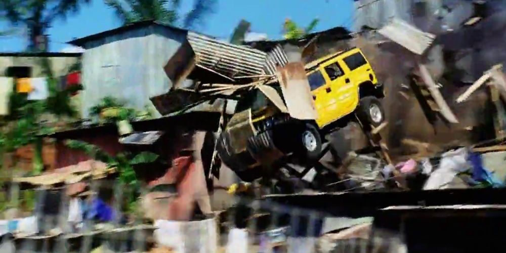 A Hummer blasts through a house in Bad Boys 2