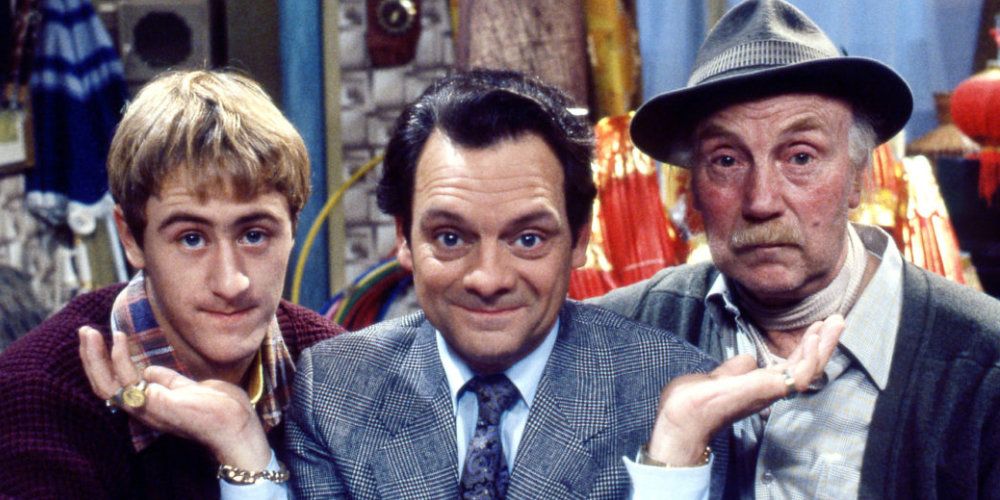An image of Rodney, Derek, and Uncle Albert smiling in Only Fools And Horses