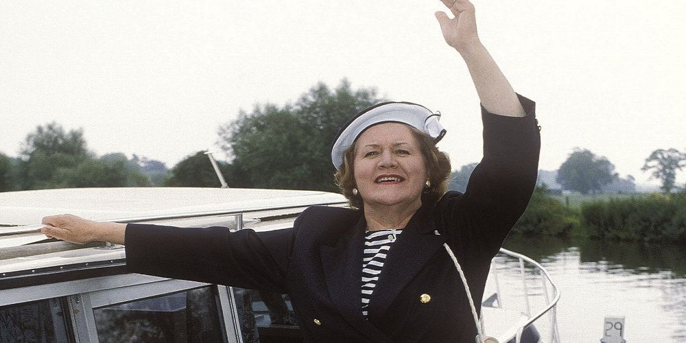 Hyacinth Bucket standing on a boat in Keeping Up Appearances