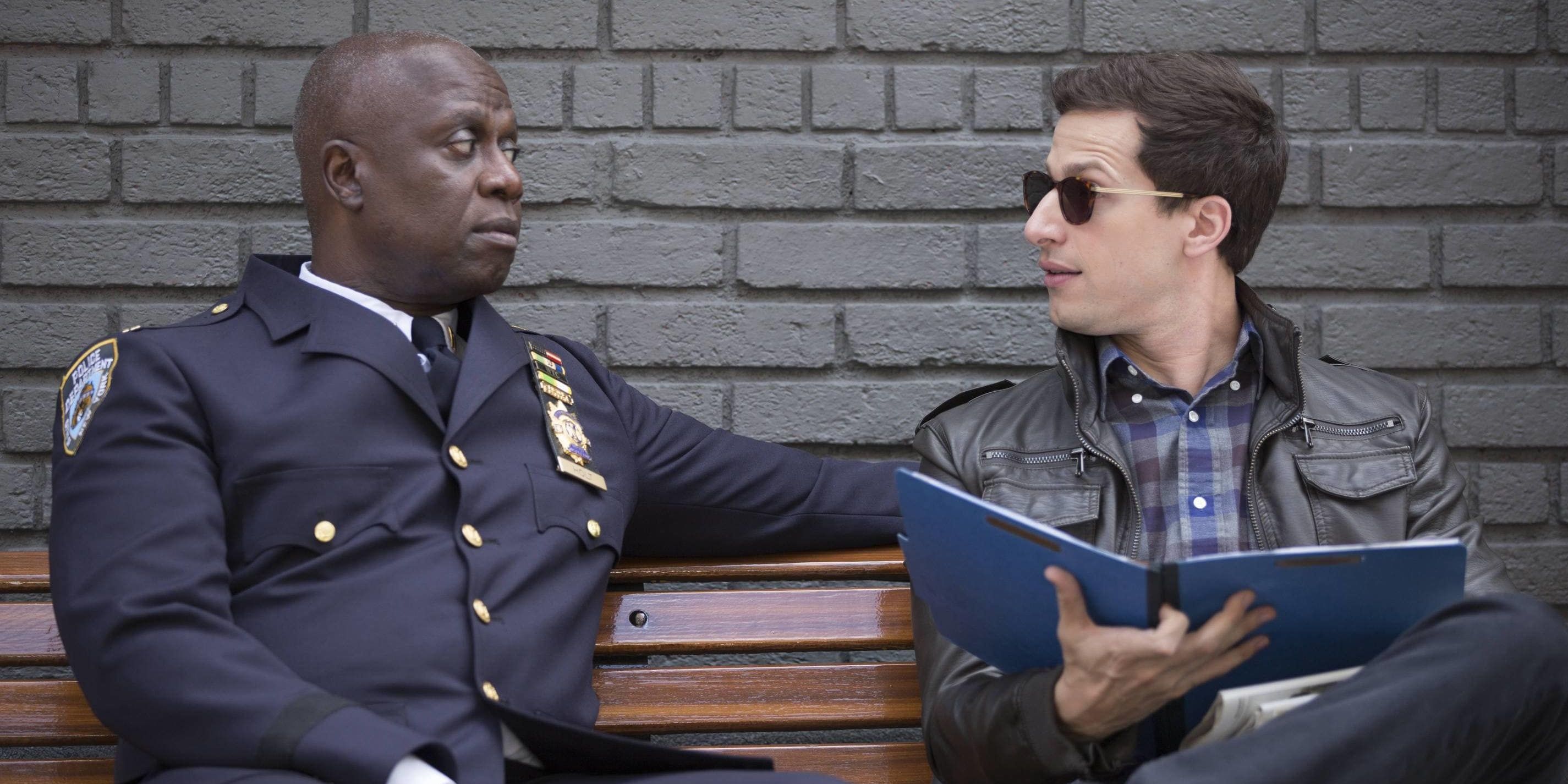 Jake and Captain Holt talk on a bench.