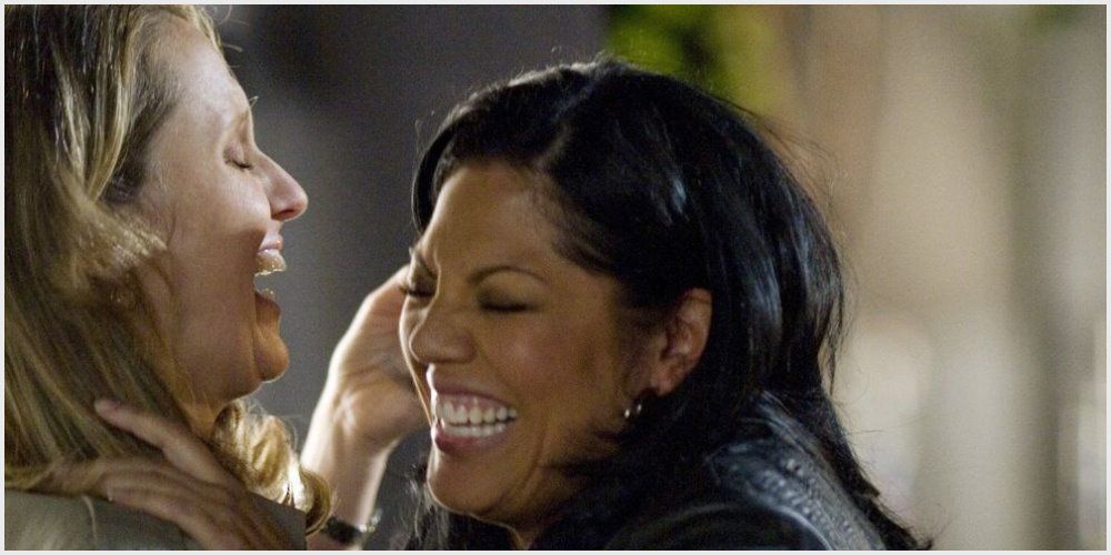 Callie and Erica smile at each other after their first kiss