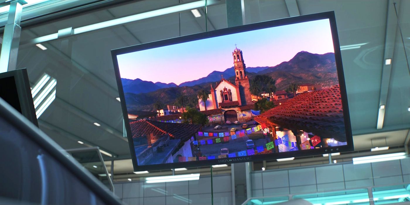 An image on a screen of a Latino town in Cars 3.