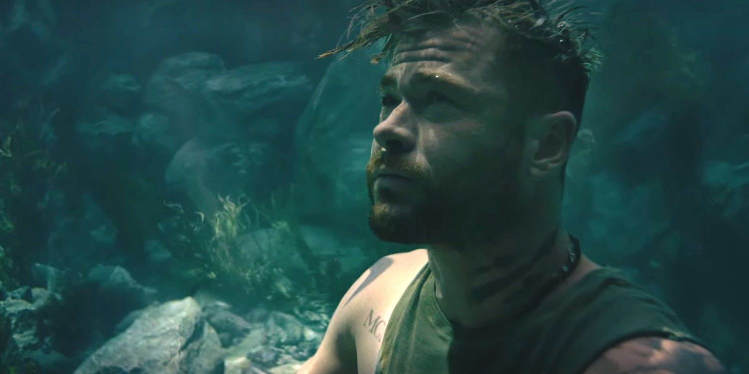 Chris Hemsworth looking up while underwater in Extraction