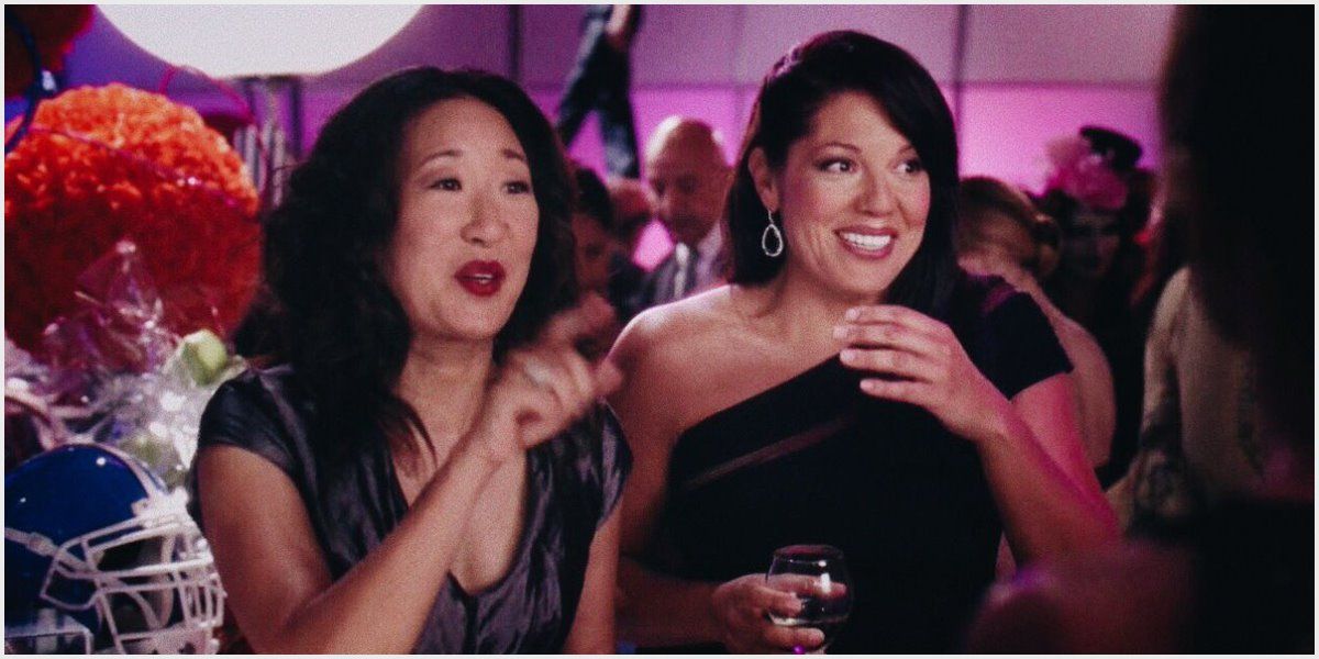 Cristina and Callie have drinks at a bar in Grey's Anatomy.