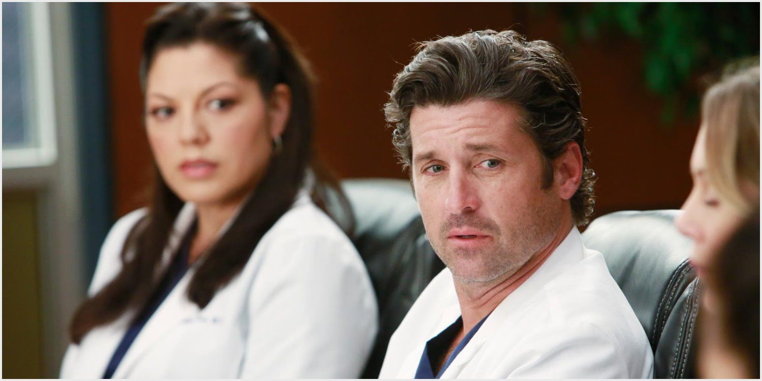 Callie sitting with Derek in conference room