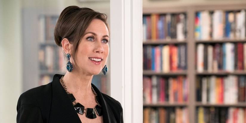 Diana standing in her office near bookshelves on Younger
