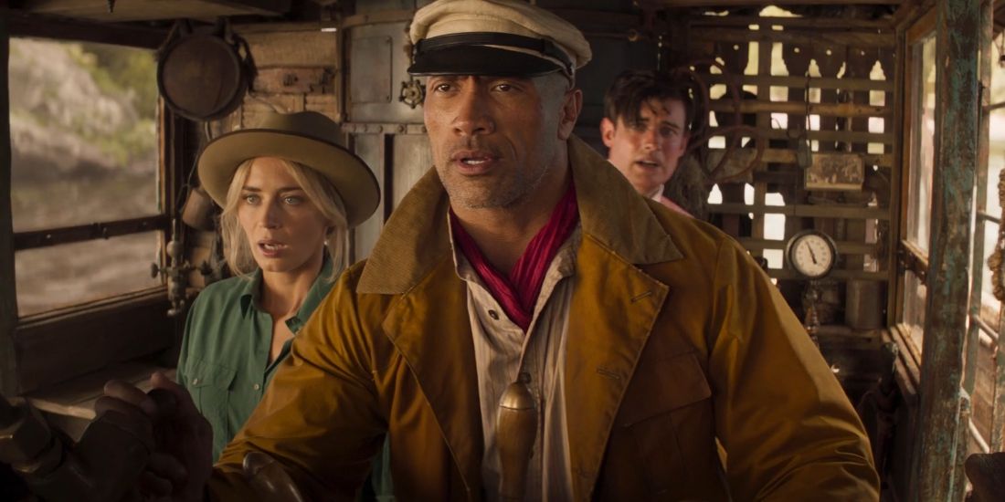 Dwayne Johnson and Emily Blunt in the boat in Jungle Cruise