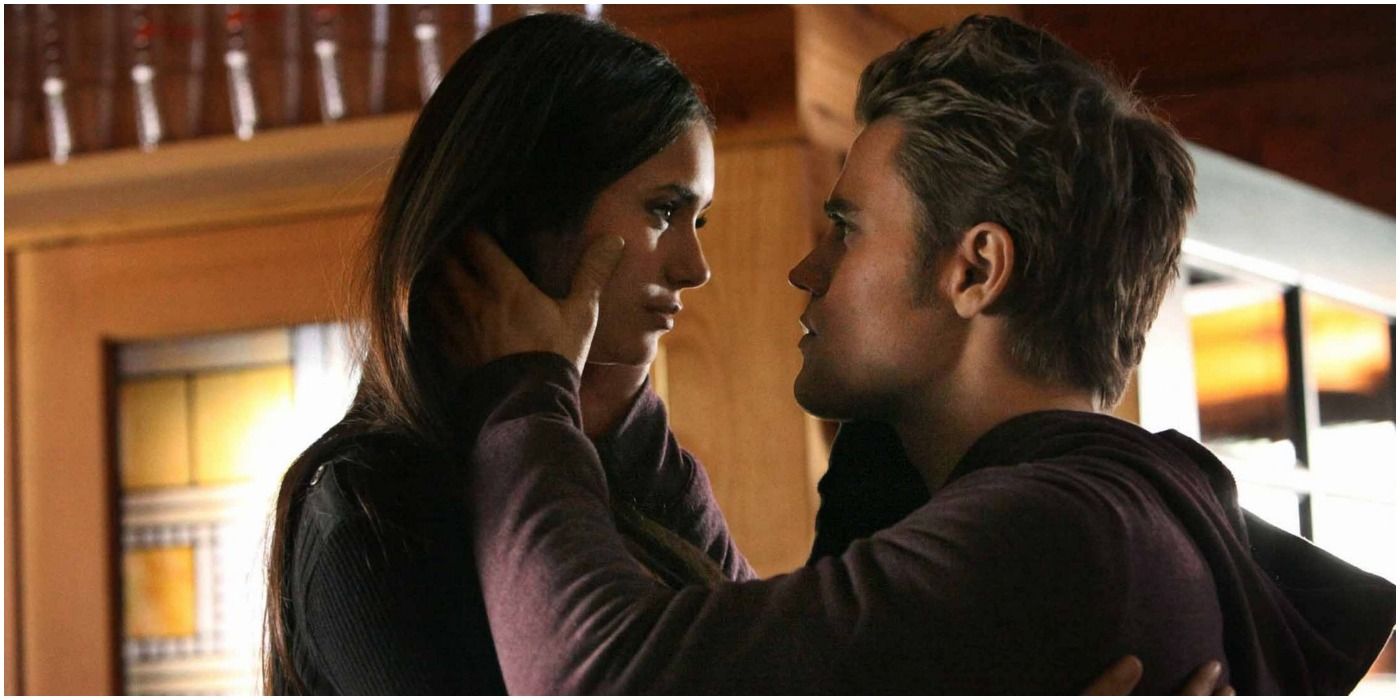 Stefan holds Elena's face in TVD.
