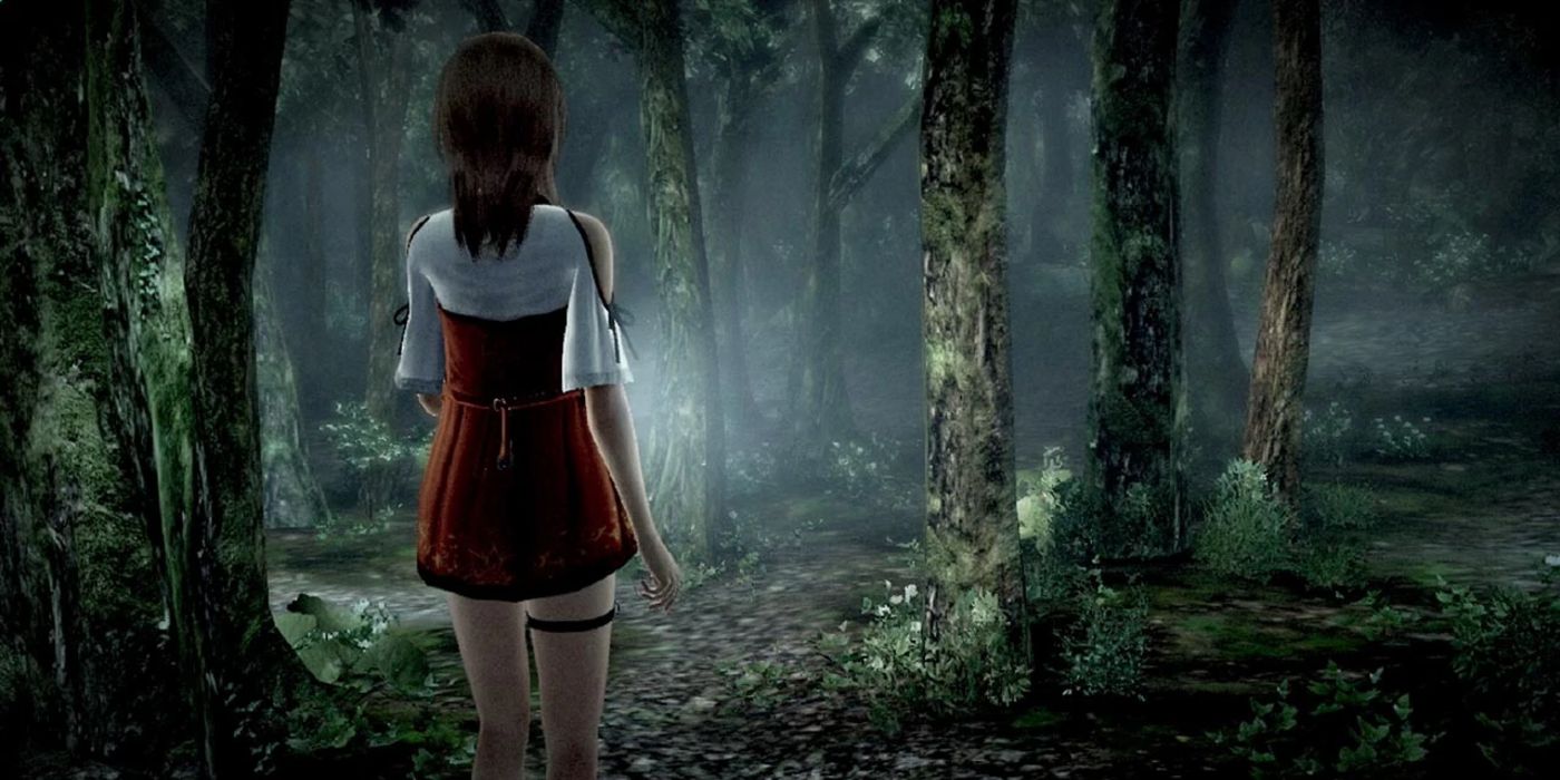 A schoolgirl walks in the foggy forest in Fatal Frame.