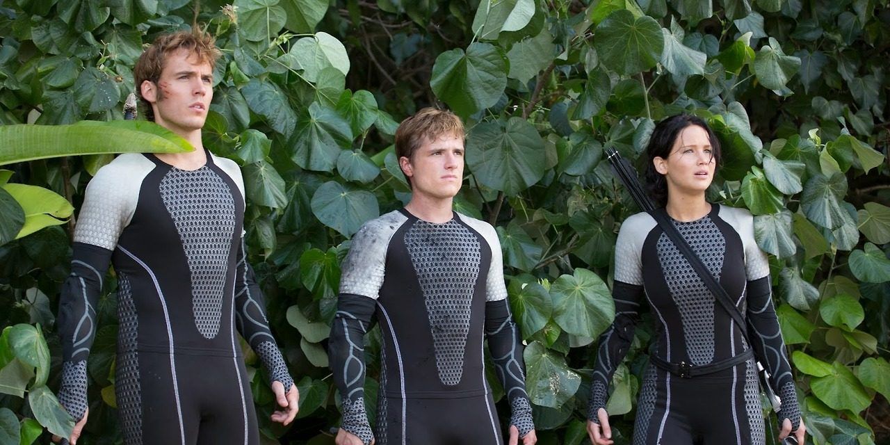 Finnick, Peeta, Katniss in the arena in Hunger Games Catching Fire