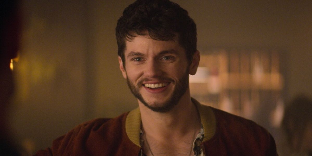 Forty Quinn smiling in Netflix's You Season 2