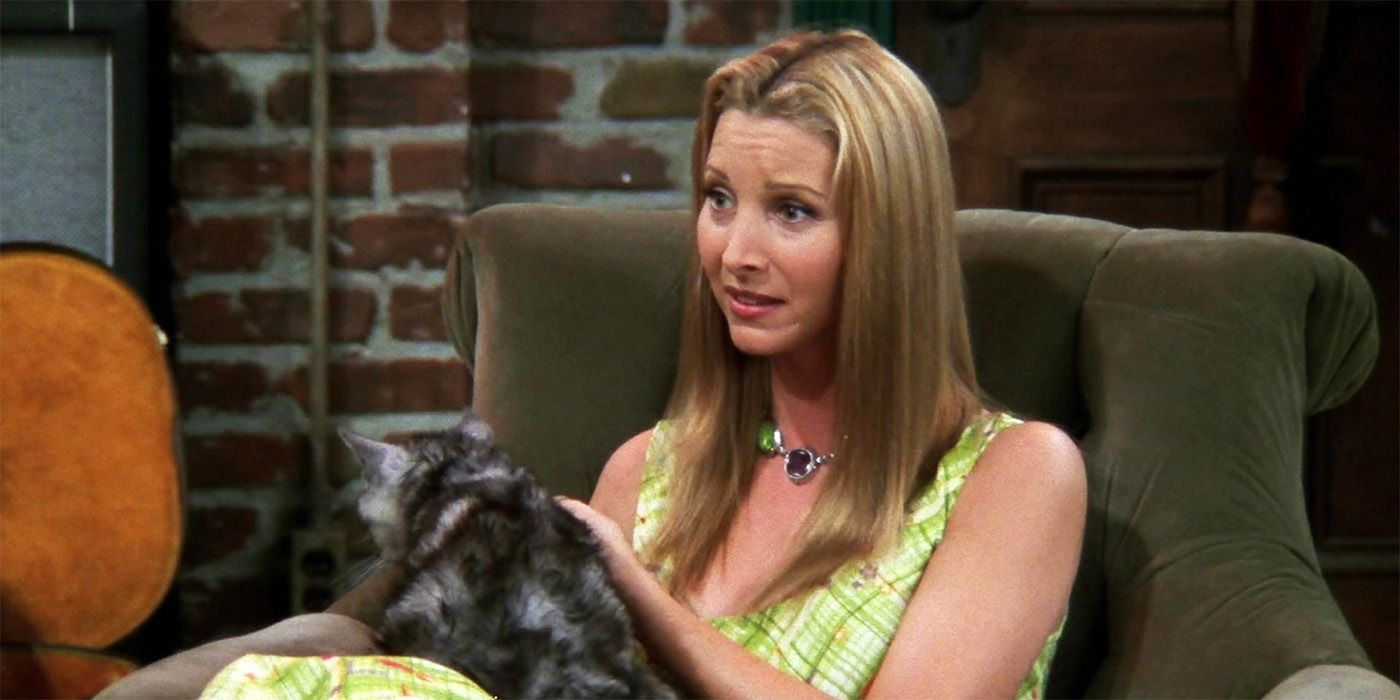 Phoebe sitting down with a cat on Friends