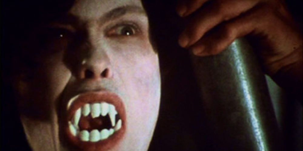 Martin the vampire showing his teeth in Martin