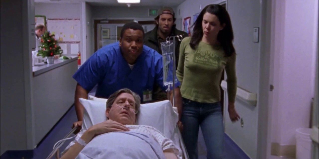 Lorelai walking beside Richard as he lay in a hospital bed after his heart attack in season 1 of Gilmore Girls