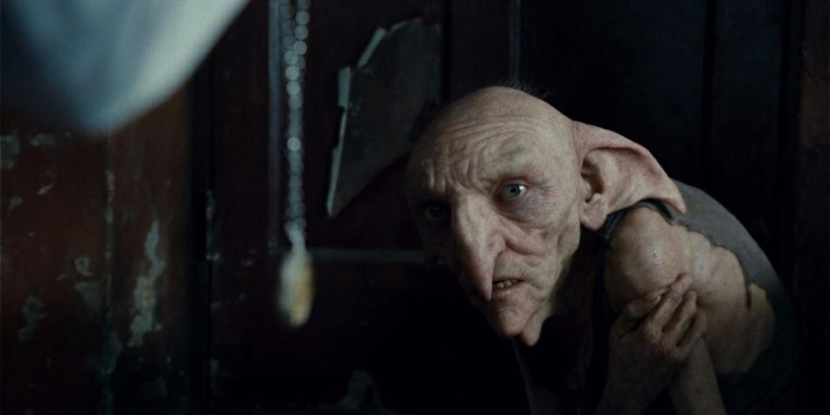 Harry brandishes the locket at Kreacher in Deathly Hallows - Part 1