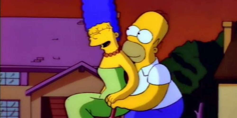 Homer and Marge riding a bike together