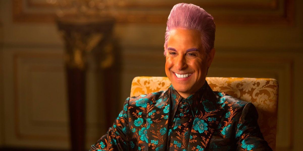 Caesar Flickerman smiling during an interview in The Hunger Games