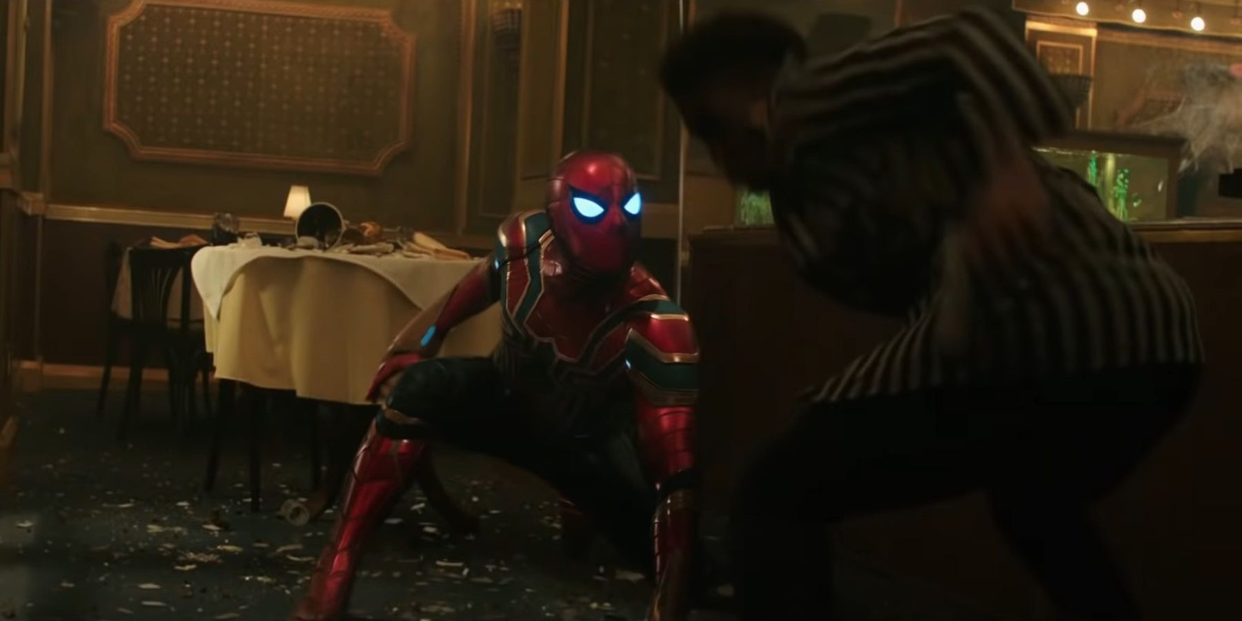 Spider-Man fights criminals in a restaurant.