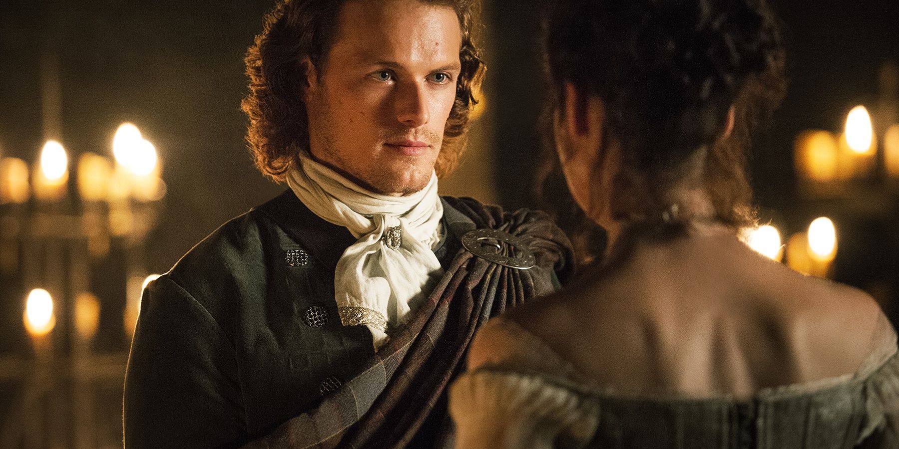 Image of Jamie looking at Claire during wedding in Outlander