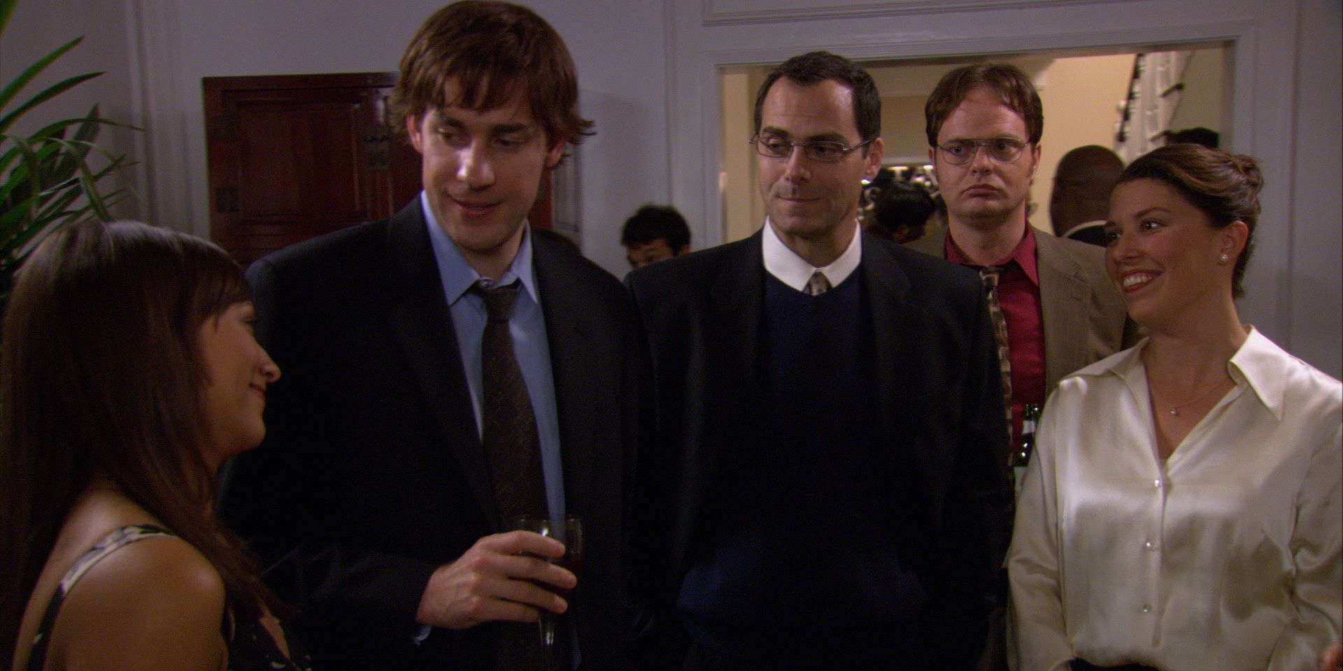 An image of Karen, Jim, David all having cocktails at a party in The Office