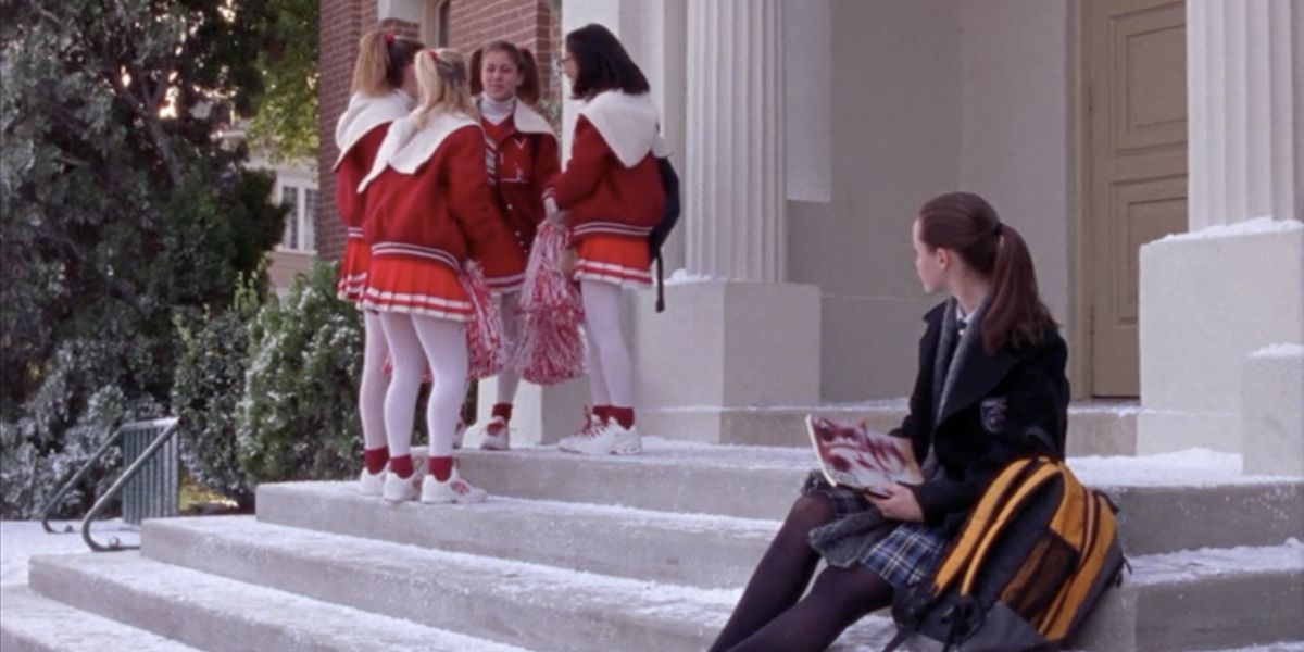 Lane As A Cheerleader while Rory looks on on Gilmore Girls