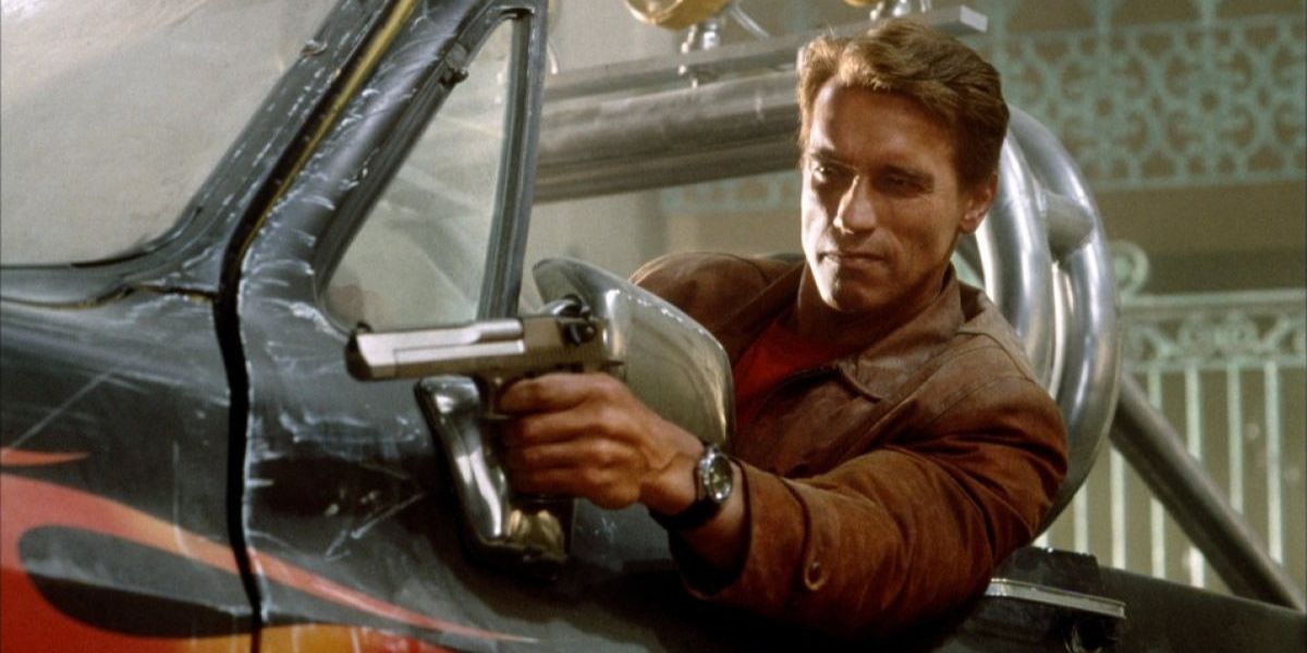 Arnold Schwarzenegger aiming gun from truck