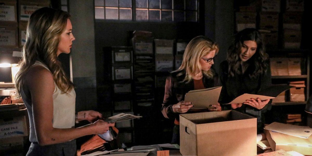 Laurel, Felicity and Dinah go through files together.