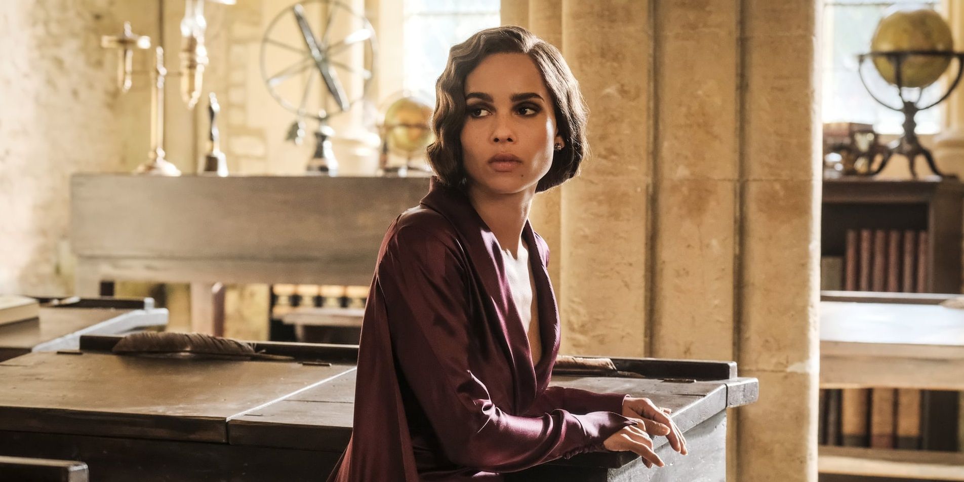 Leta Lestrange sitting down and looking serious in The Crimes of Grindelwald