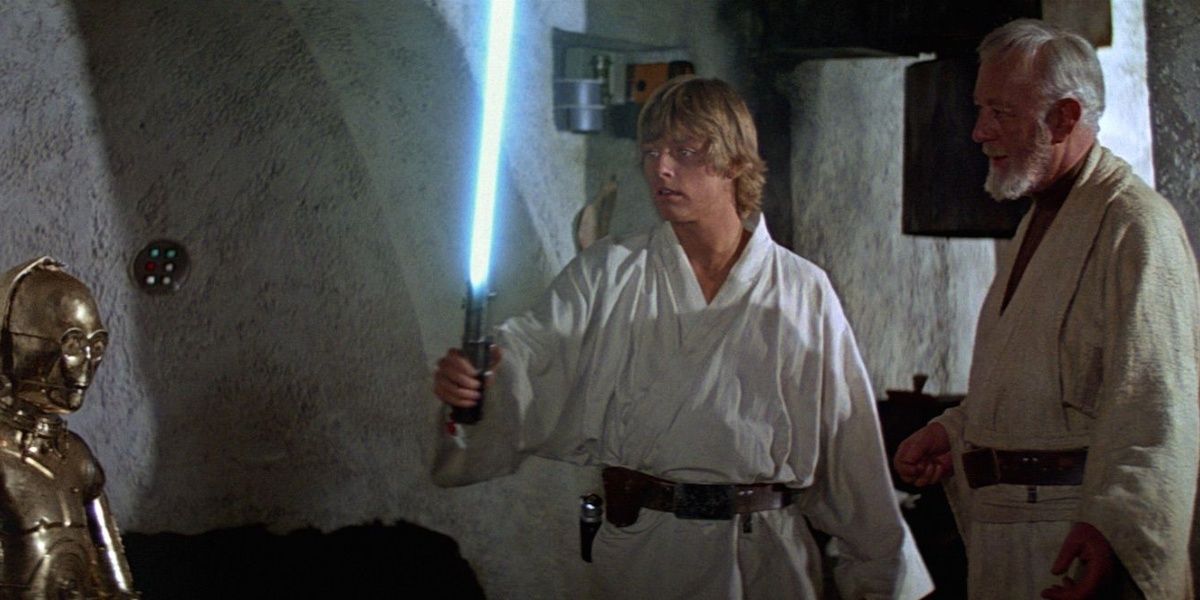 Obi-Wan Kenobi gives Luke the Skywalker lightsaber in A New Hope