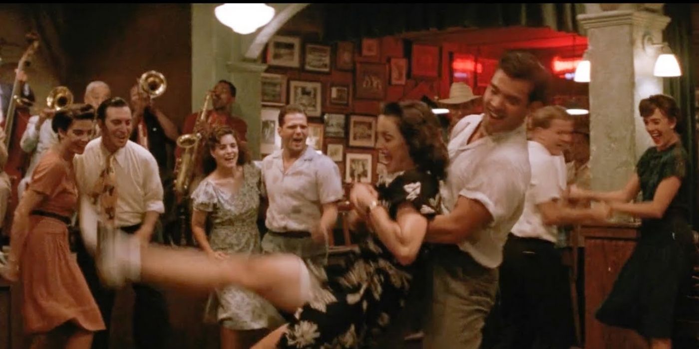 Mae dancing with a partner in the bar in A League of their Own