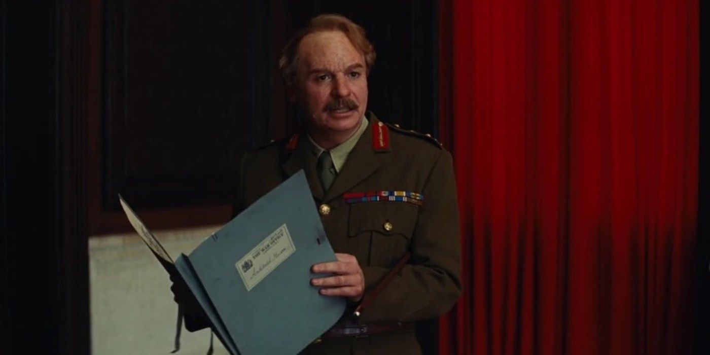 Mike Myers reads from a folder in Inglourious Basterds