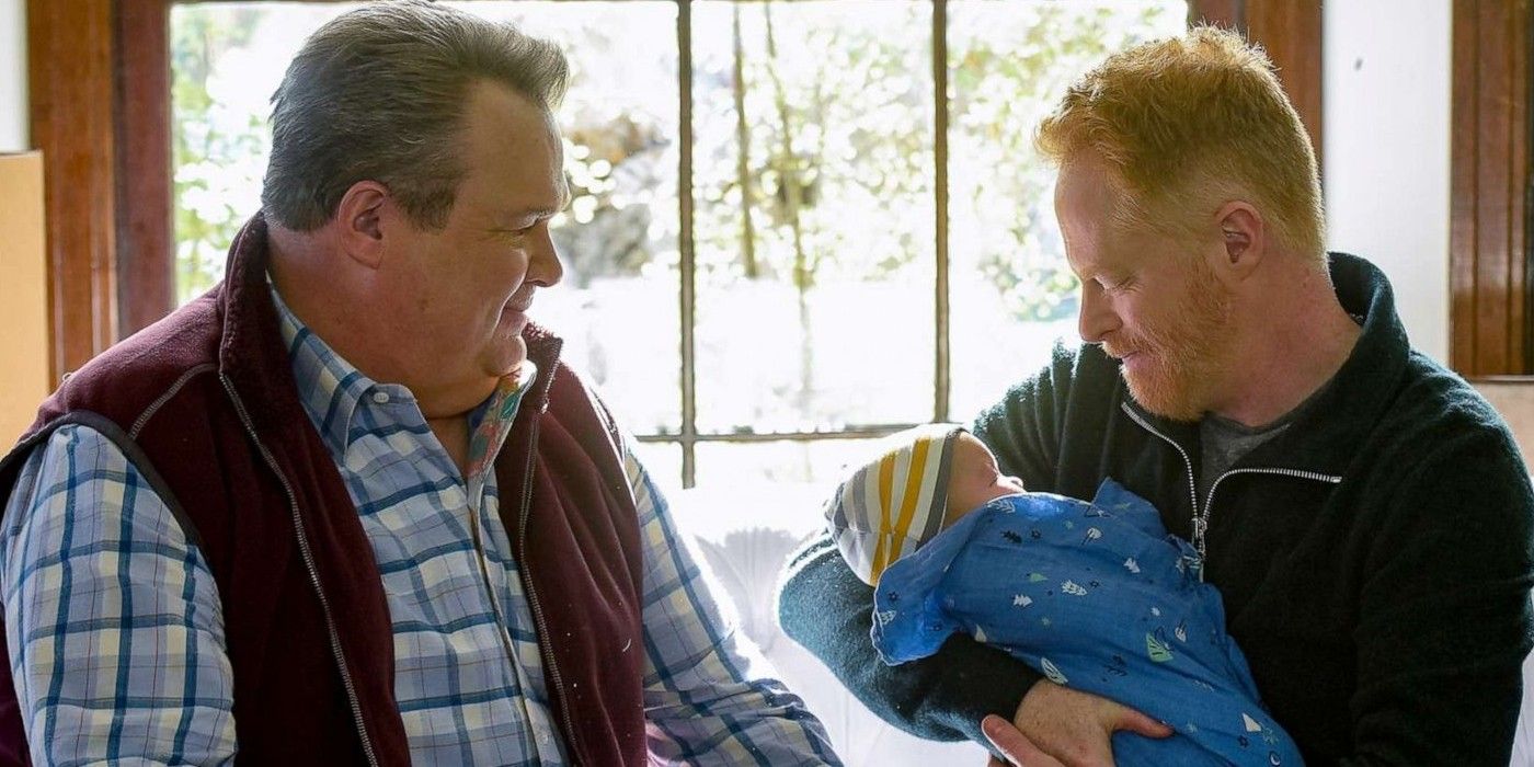 Cam, Mitch, and baby on Modern Family