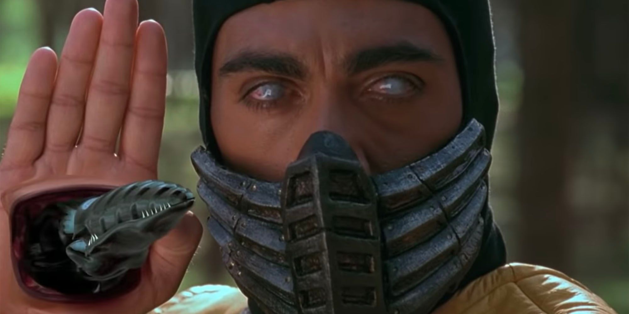 Scorpion's Snake Weapon emerges from his palm.