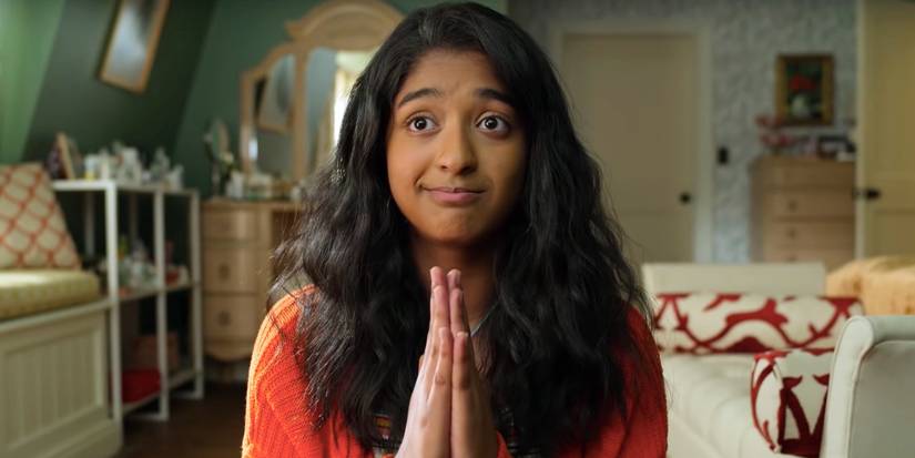 Maitreyi Ramakrishnan as Devi with her hands pressed in prayer in Never Have I Ever