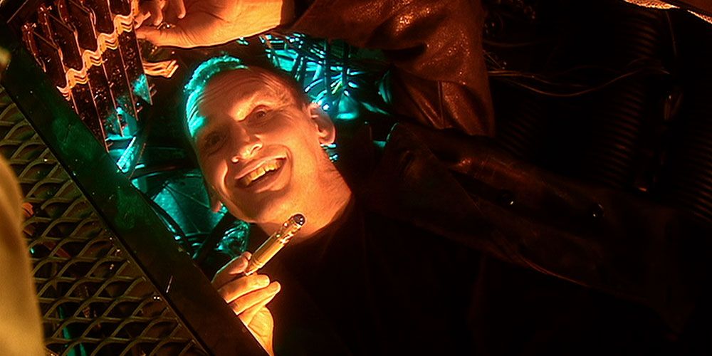 The Ninth Doctor smiling widely in Doctor Who