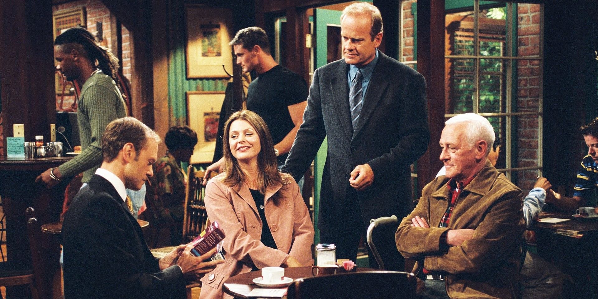 The cast of Frasier sitting in a restaurant 