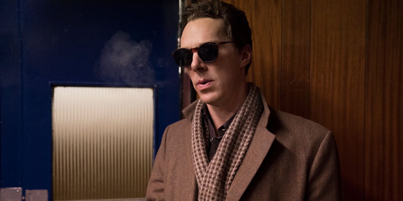 Patrick Melrose standing in an office.