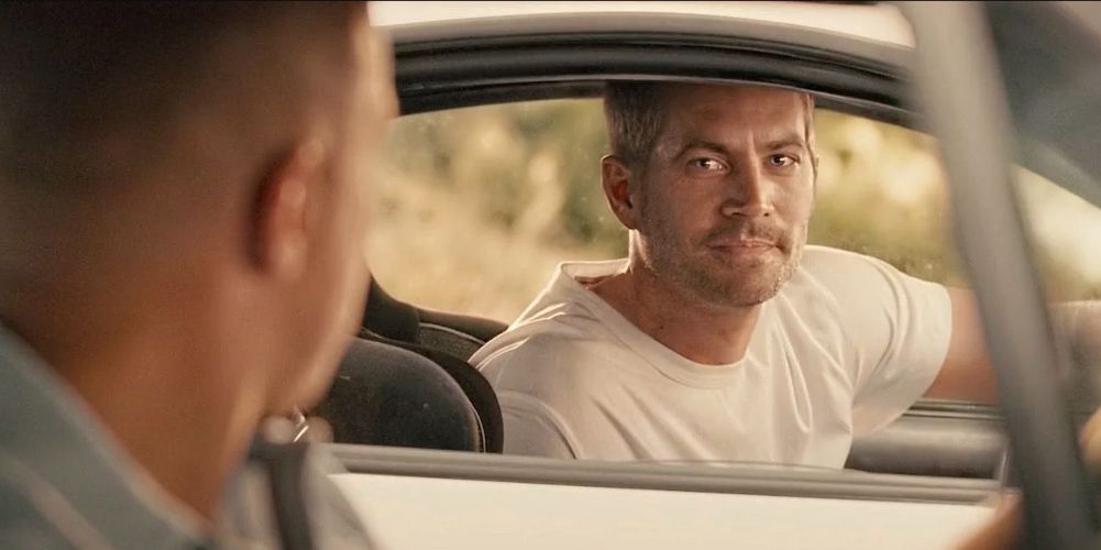 Brian and Dom looking at each other from their cars in Furious 7