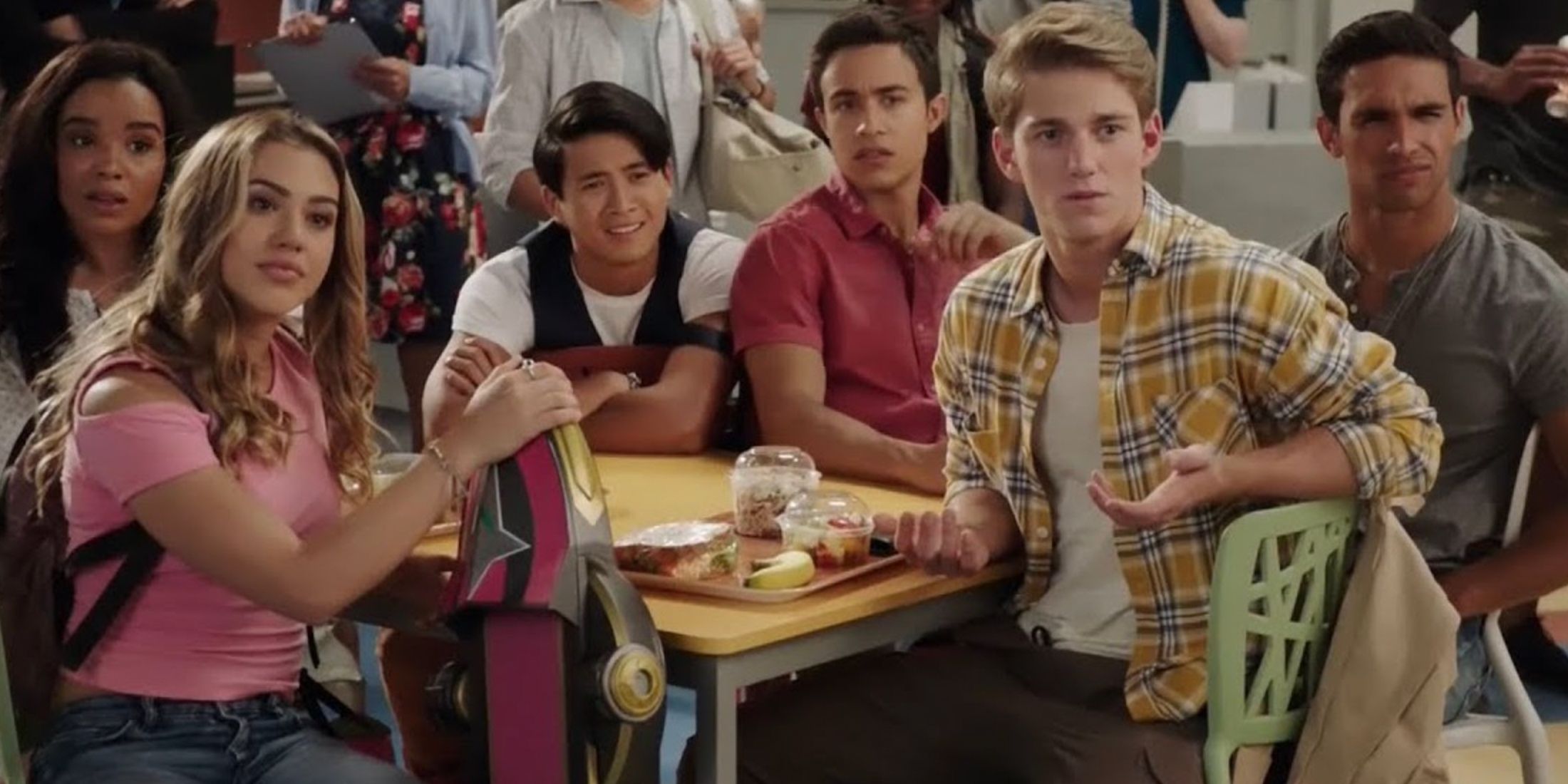 Power Rangers Ninja Steel team members sit together at a cafeteria lunch table