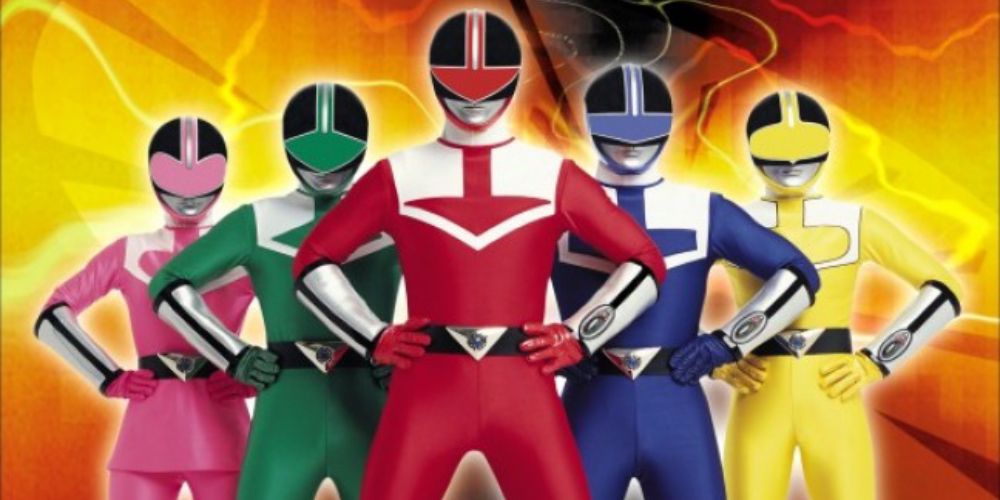 The five Time Force Power Rangers stand together, hands on their waists, in a promotional image for the show