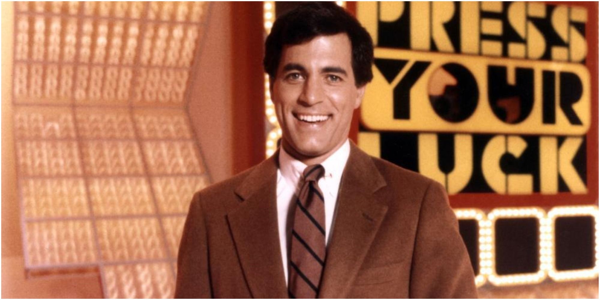 Peter Tomarken smiles as he hosts the '80s game show Press Your Luck.