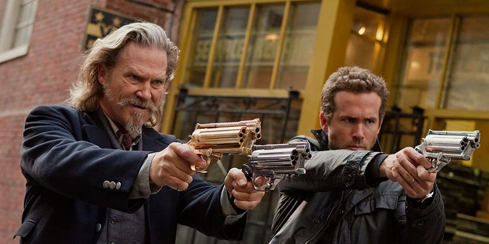 Jeff Bridges and Ryan Reynolds point their guns in RIPD