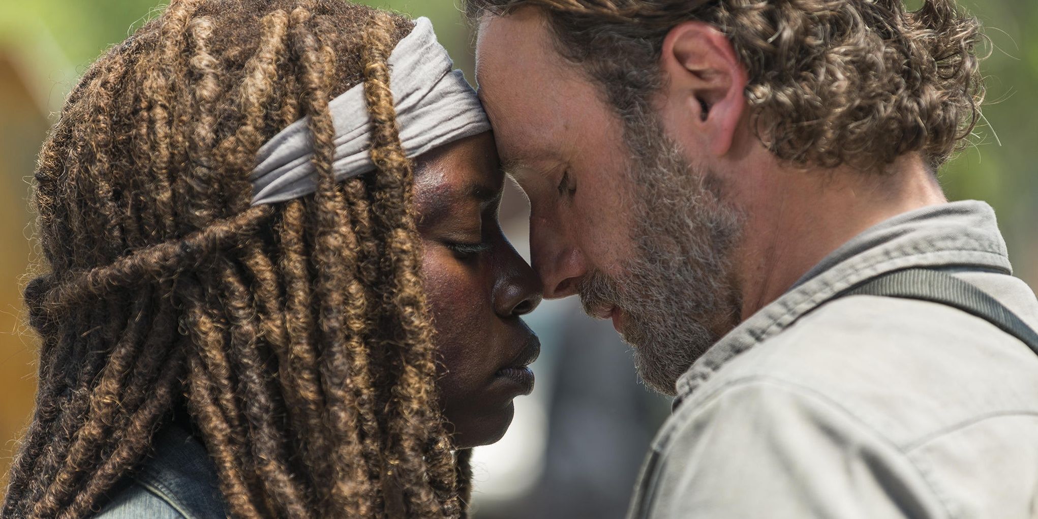 Rick and Michonne embracing in The Walking Dead.