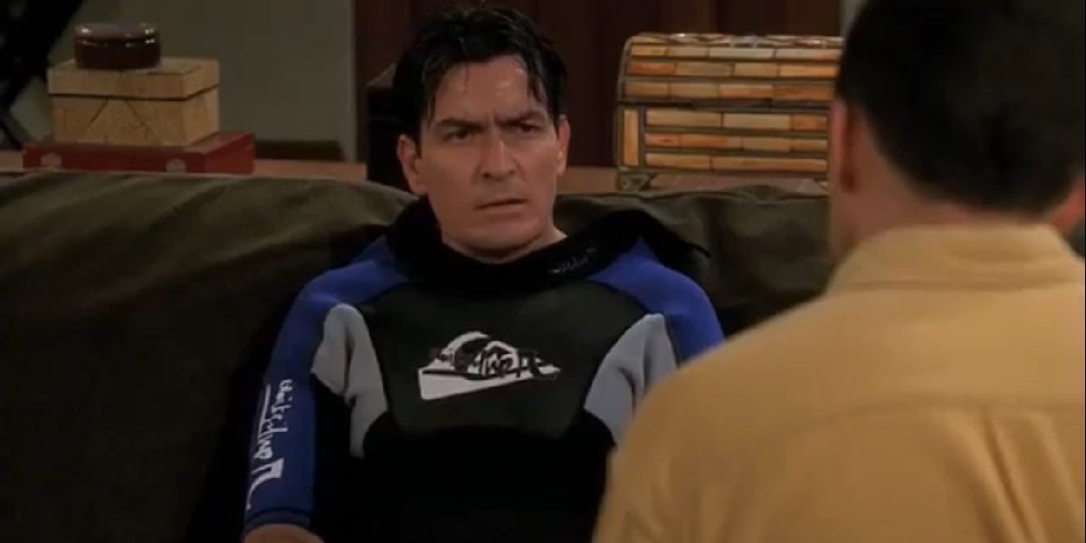 Charlie in a blue wet suit staring at Alan in Two and a half men