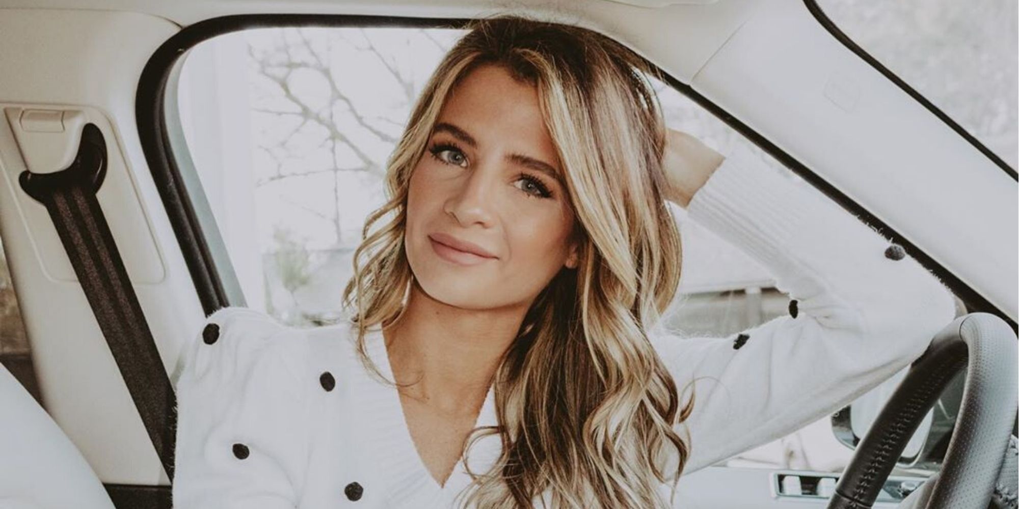 Southern Charm's Naomie Olindo with elbow on steering wheel in car