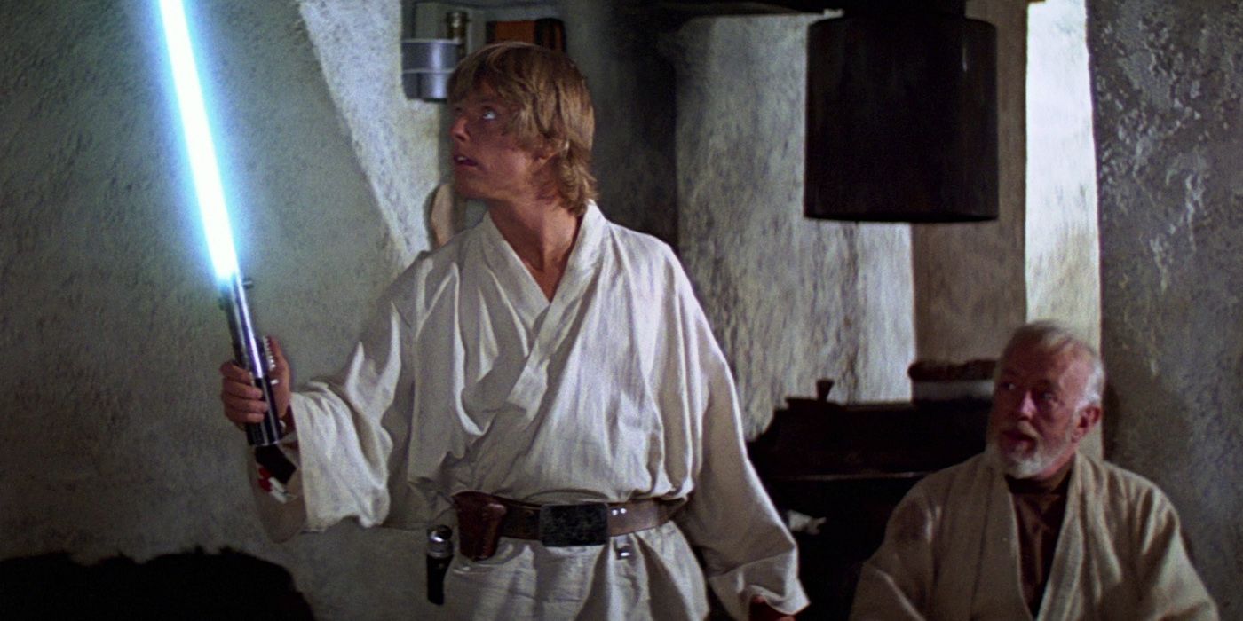 Star Wars's Luke Skywalker examines a blue lightsaber