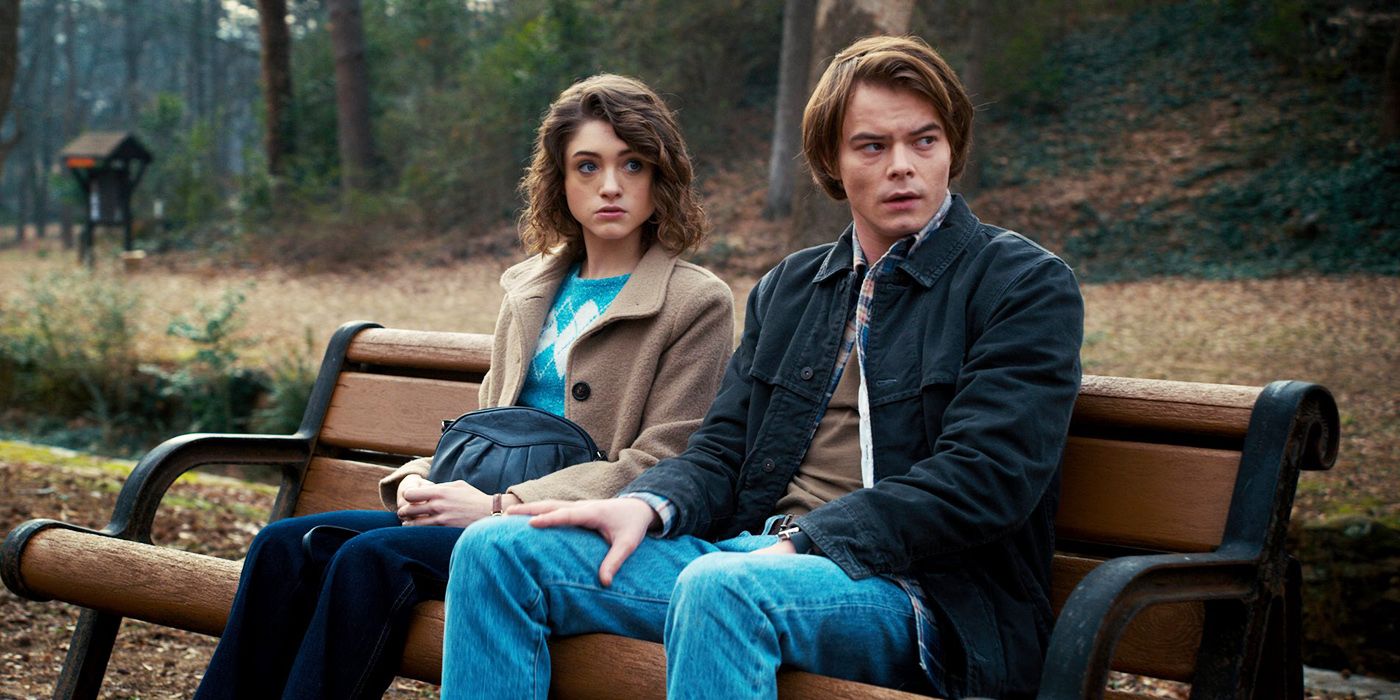 Nancy and Jonathan sitting on a bench in Stranger Things